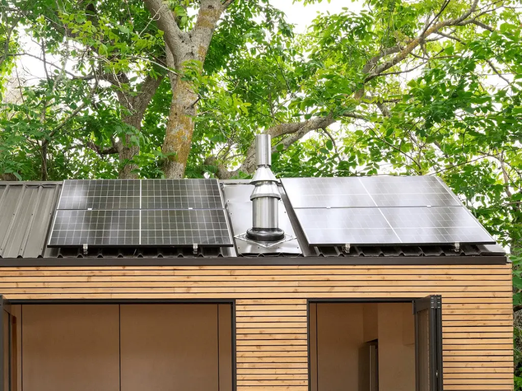view of residential solar panels under trees