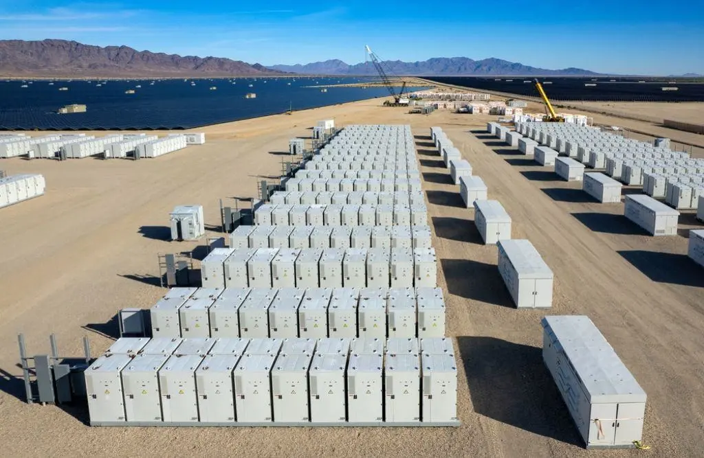 Aerial view of desert solar farm battery storage units.