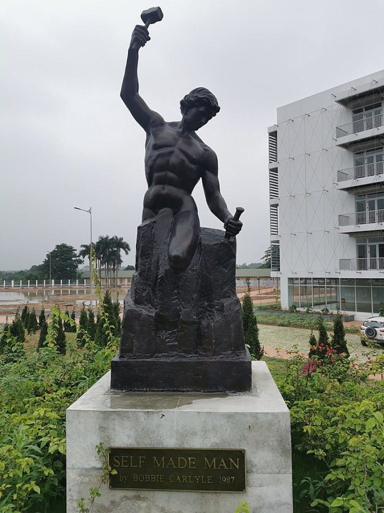 “Self made man” statue created by American sculptor Bobbie Carlyle, Living Wheel Park, Parker, CO
