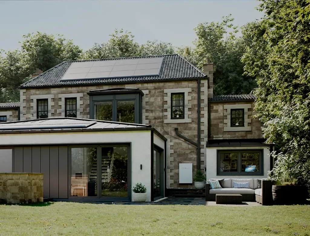 A beautiful house with installed Tesla Powerwall battery at daytime