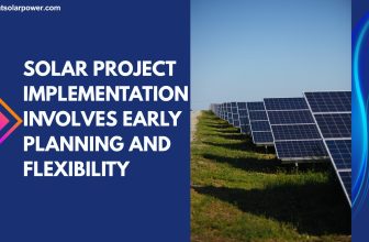 Solar installer reviewing compliance documents on site